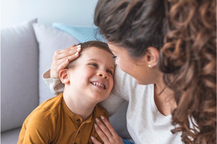 A babysitter looking into the eyes of a child she is caring for